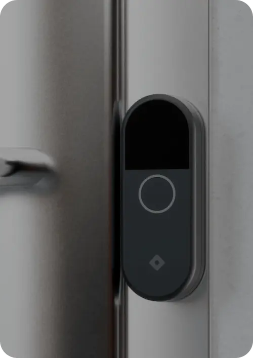 Rhombus DR20 door reader for access control system installed next to a door, showcasing a modern door access control system. This sleek device is a key component of advanced access control systems, offering mobile access and seamless integration with access control management software for enhanced building security and controlling access to entry points.