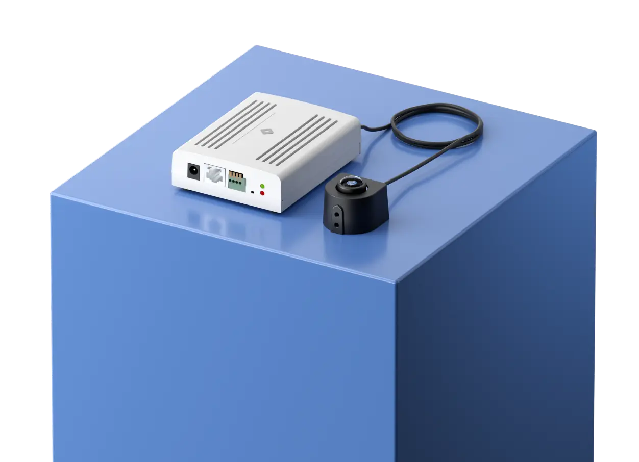 A mini camera displayed on a podium, highlighting the advanced technology and design of Rhombus mini camera for enhanced security solutions.