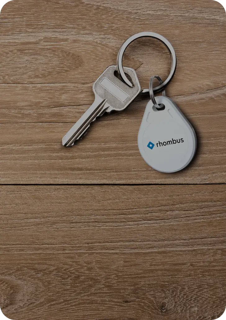 Employee using a Rhombus Secure Card for access control system to tap on a DR20 door reader, demonstrating efficient door access control solutions. This modern door access system ensures secure and convenient entry for authorized personnel. Rhombus access control software seamlessly integrates with door readers, enhancing security and management capabilities.