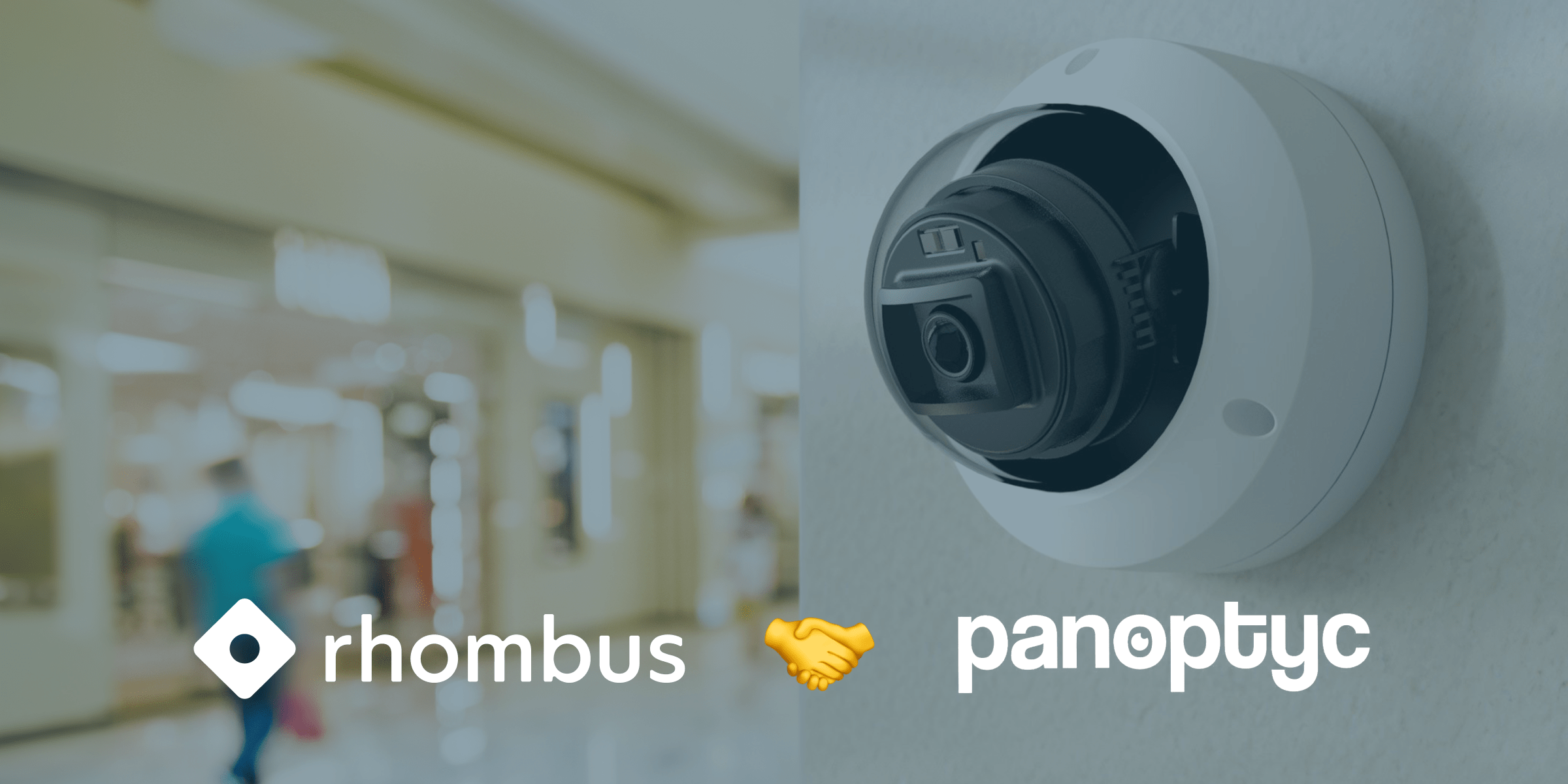Rhombus and Panoptyc Security Partnership Dome security camera by Rhombus mounted on wall with blurred retail space background. Company logos and handshake emoji shown below.