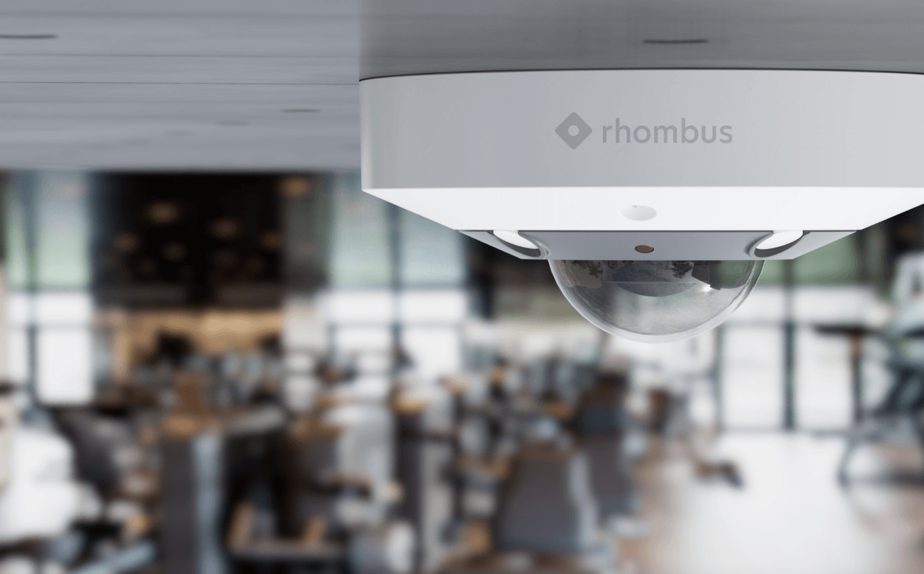 Rhombus R360 fisheye camera installed outdoors, providing panoramic views for wide area surveillance and is NDAA compliant.