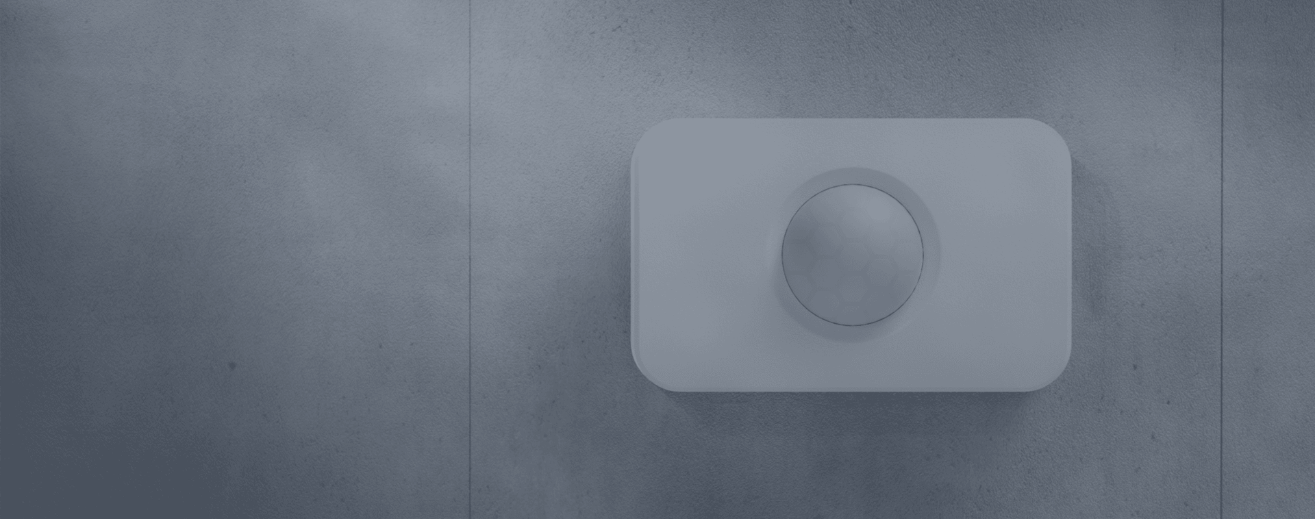 The M15 motion sensor, mounted on a wall, monitors camera less locations and delivers real-time insights through advanced motion sensing technology