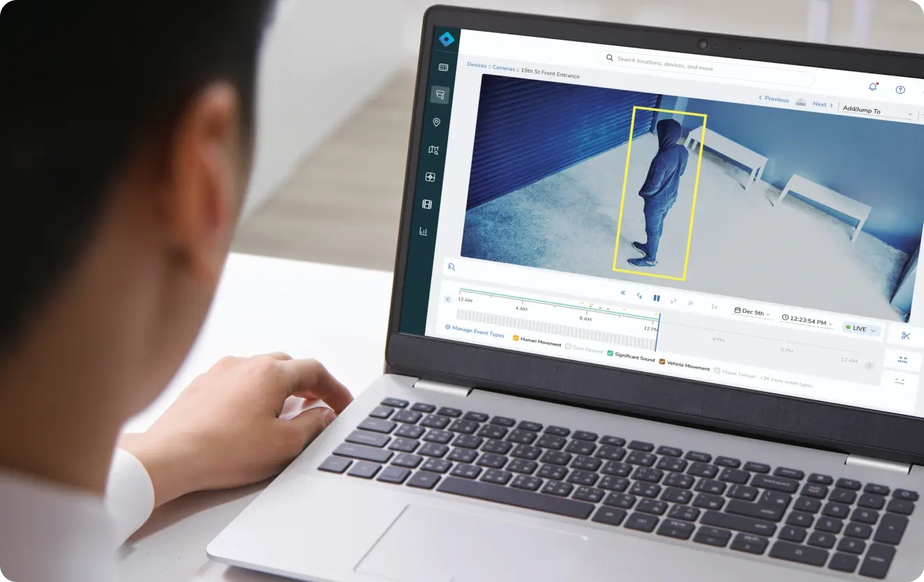 A man is alerted on his screen by Rhombus alarm monitoring regarding an intruder