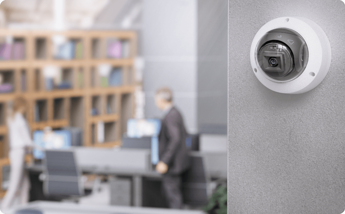 Indoor dome camera with a discreet design in an office, ensuring secure access to video data while blending seamlessly with the surroundings.